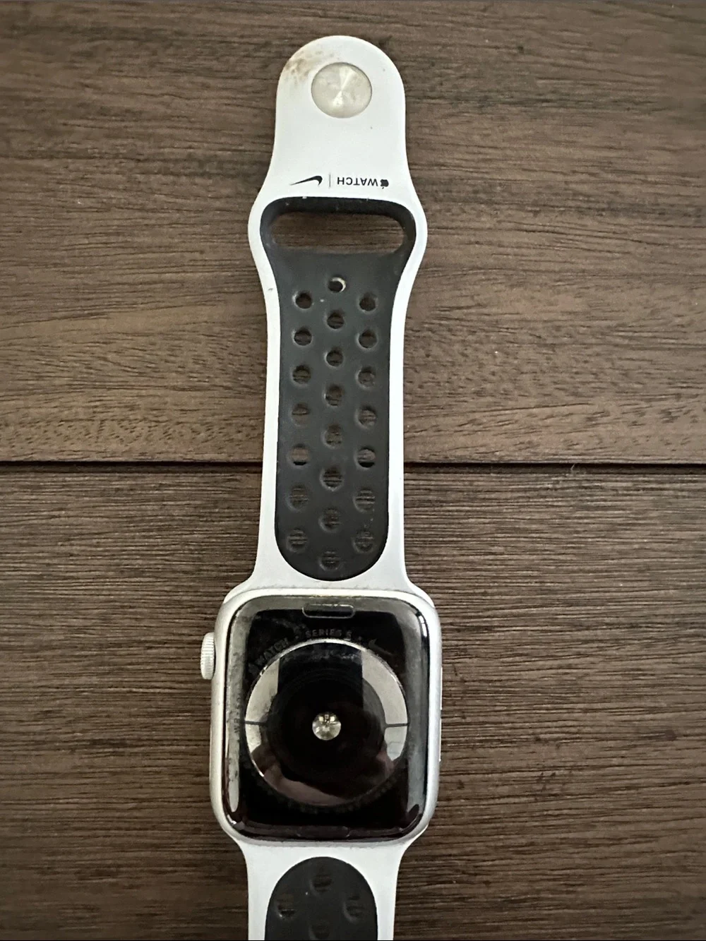 Apple Watch with White Perforated Sport Band. Nike addition series 5